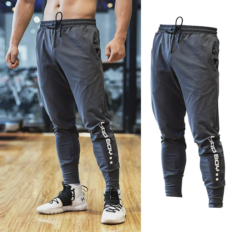 Pantalón deportivo para hombre con bolsillos y cremallera, pantalones de entrenamiento para culturismo, pantalones largos para correr, pantalones de