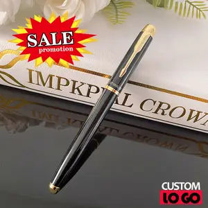 black color diary and Parker Jotter XL Yellowgold 2122754 ballpoint pen