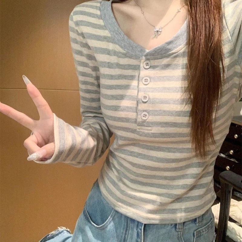 Spring new button Korean version striped T-shirt women slim fit retro versatile round neck color blocking long sleeved top