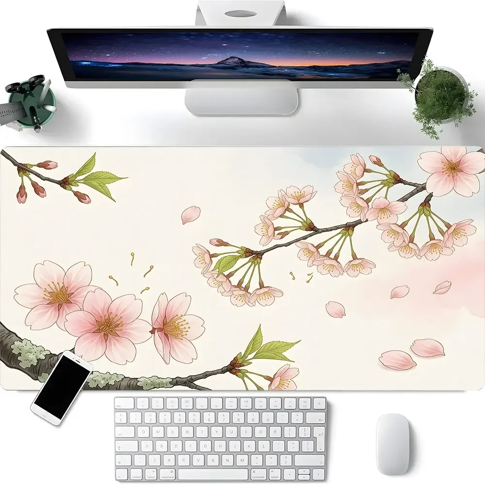 A large gaming mousepad in pastel color with floral patterns, an expandable keyboard desk mat, a non-slip rubber base