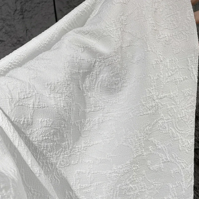 

White Patterned Fabric with Embossed and Pleated Texture Three-dimensional Jacquard Fabric Creative Clothing Background Fabric