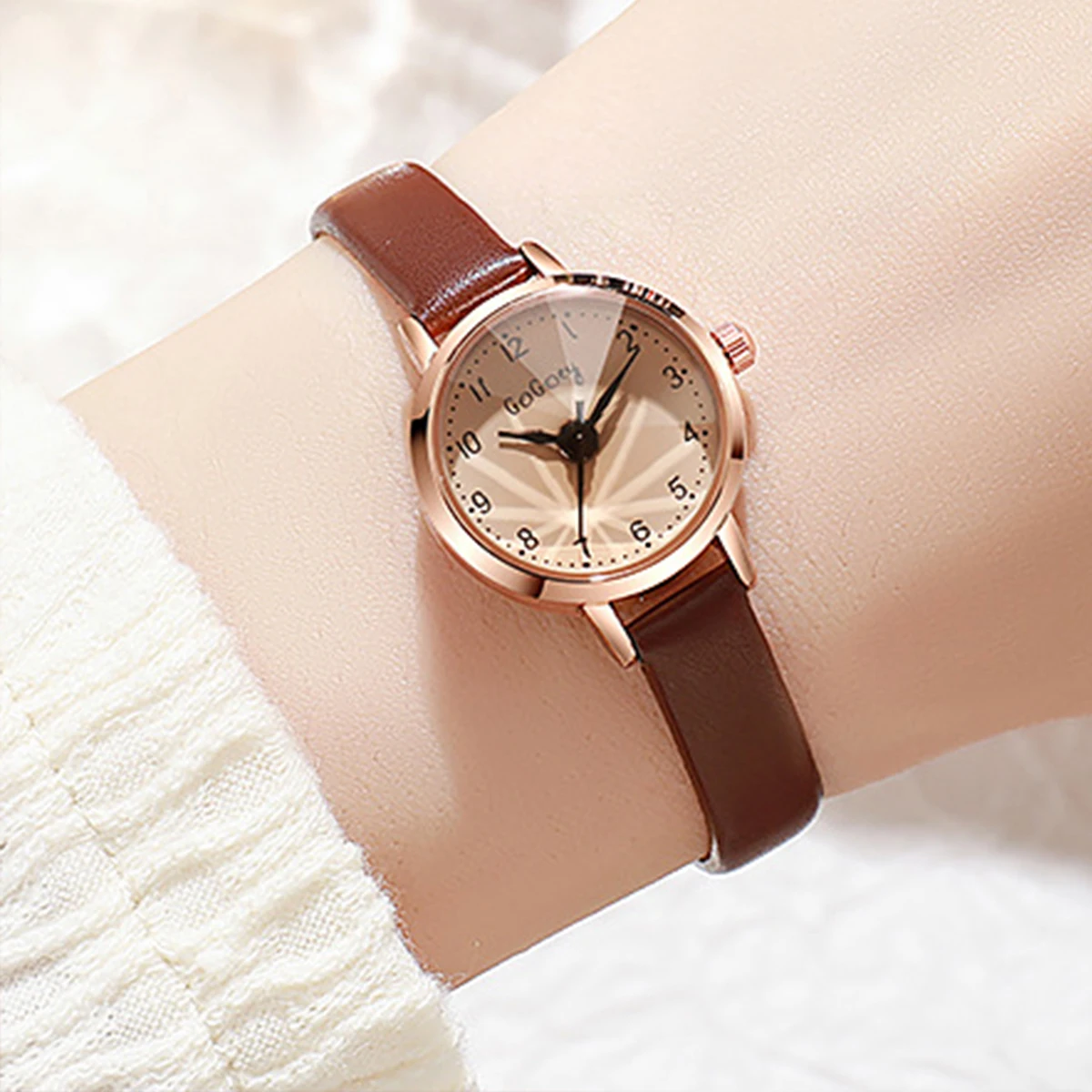 Women\'s fashion High appearance level Arabic digital dial round small dial belt quartz watch.