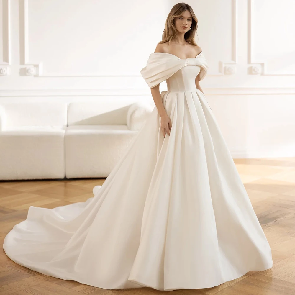 

Charming Bow Off the Shoulder Wedding Dress Elegant Open Back A-Line Floor Length with Pocket Pleat Bridal Sweep Train Gowns