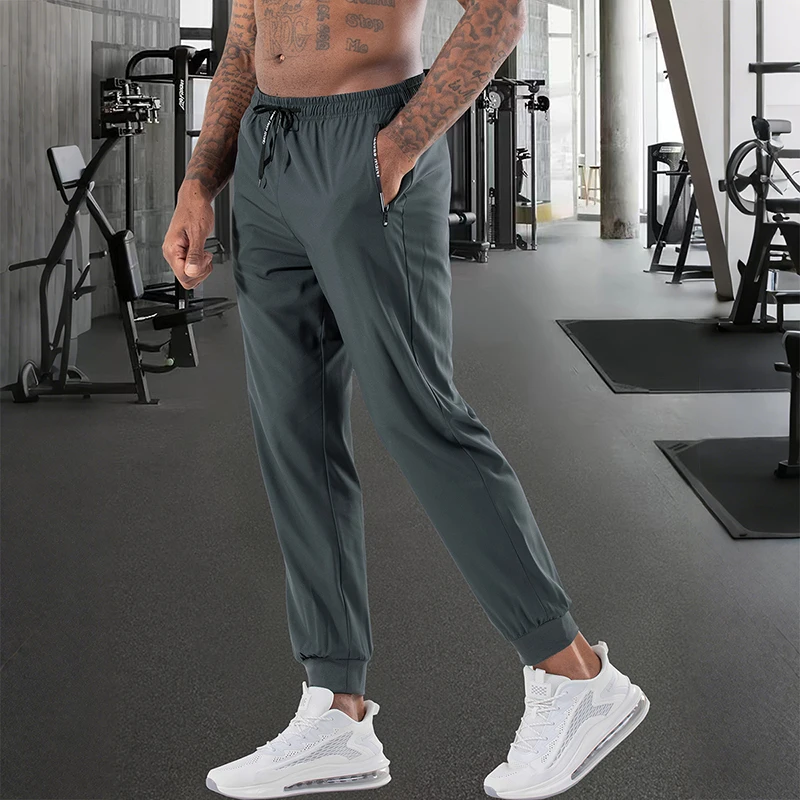 

Men High Elasticity Ice Silky Joggers with Zipper Pockets Breathable Stretchy Athletic Pants for Running Gym and Outdoor Activit