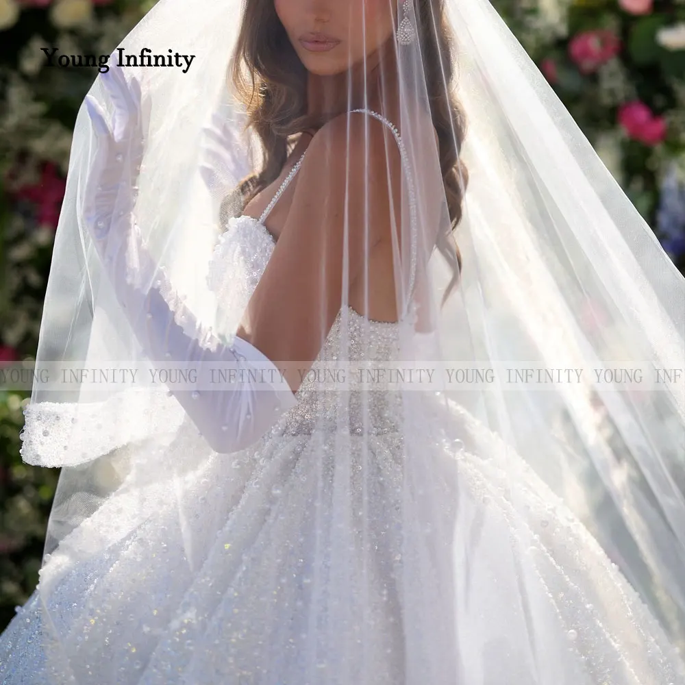 Vestidos de novia románticos 2025 vestido de novia tela brillante con cuentas ropa Formal de novia larga espagueti sin espalda cariño