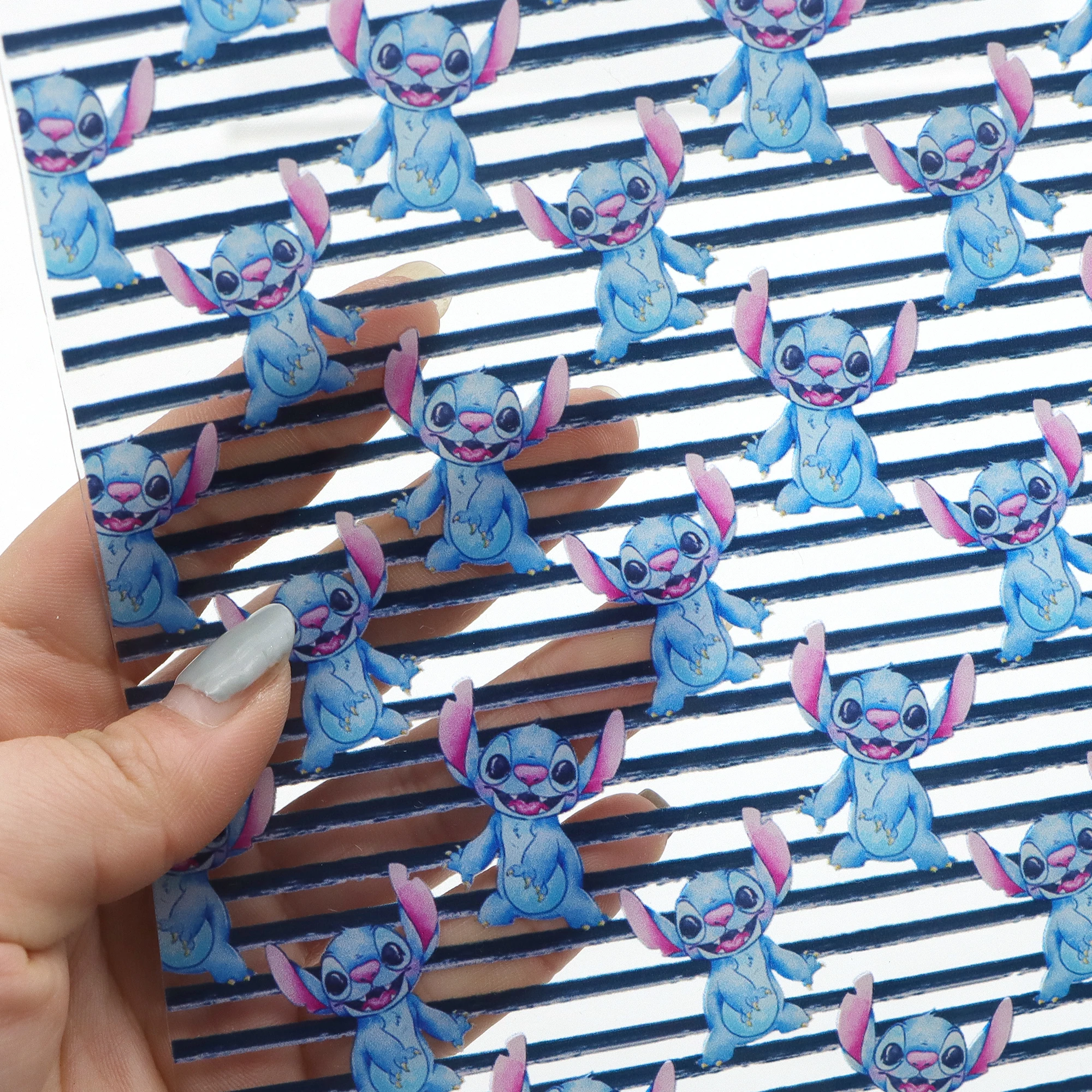 

Lilo And Stitch Transparent UV Printed Faux Synthetic Leather Sheets DIY Waterproof Sewing Bow Bag Hair Bows Craft Supply