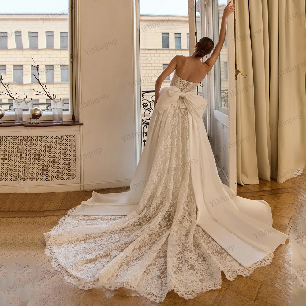 فساتين زفاف عتيقة مع فيونكة بدون حمالات على شكل حرف a فيستدو دي نوفيا بودا مزينة بدون أكمام وأربطة فساتين العروس حسب الطلب