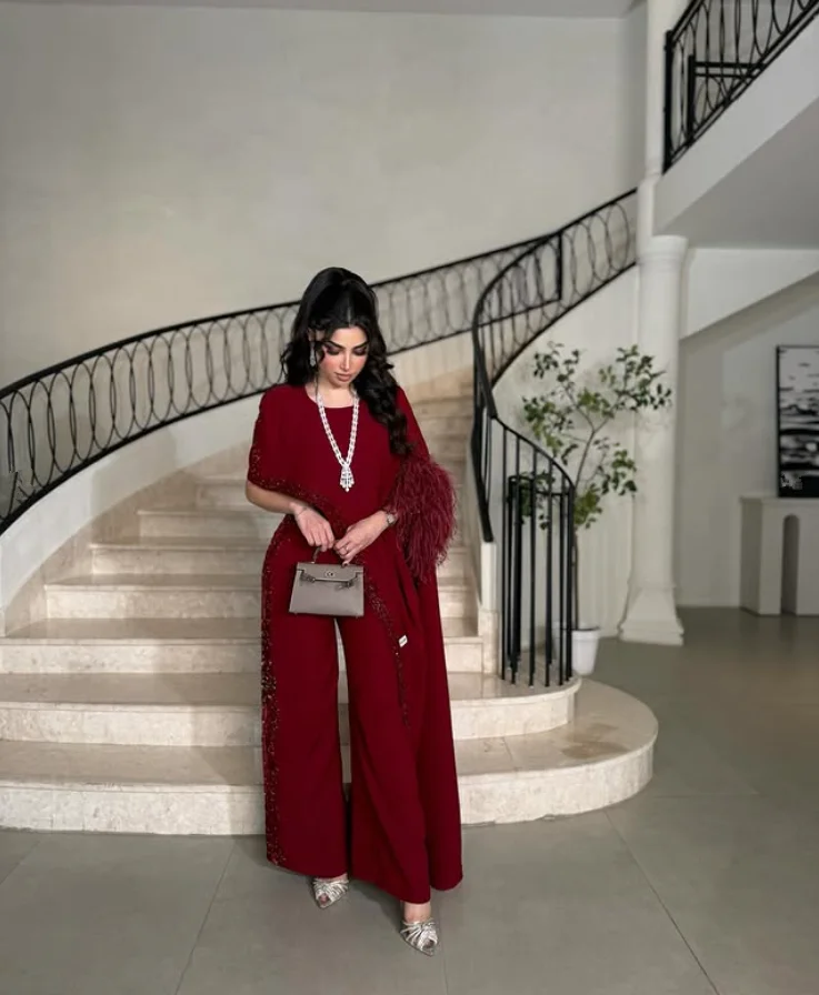 Burgundy Sparkly Jumpsuit Prom Dresses with Cape Applique Feather Saudi Customized Jersey Evening Gown Pant Suit Outfit