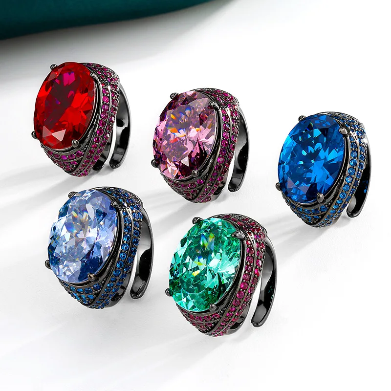 

Adjustable Black Plated Ring with Prong Setting Oval Cut 13×18mm Teal Blue Gemstone Pink Blue CZ Accents Bold Statement Jewelry