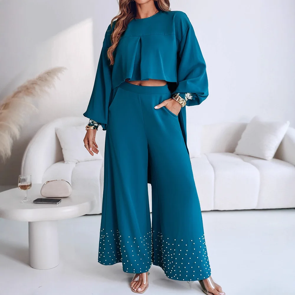 

Комплект из двух предметов: рукав-фонарик, высокий низкий подол, плиссированный топ с открытой спиной, повседневный комплект с жемчугом и эластичной спиной на талии, широкие брюки