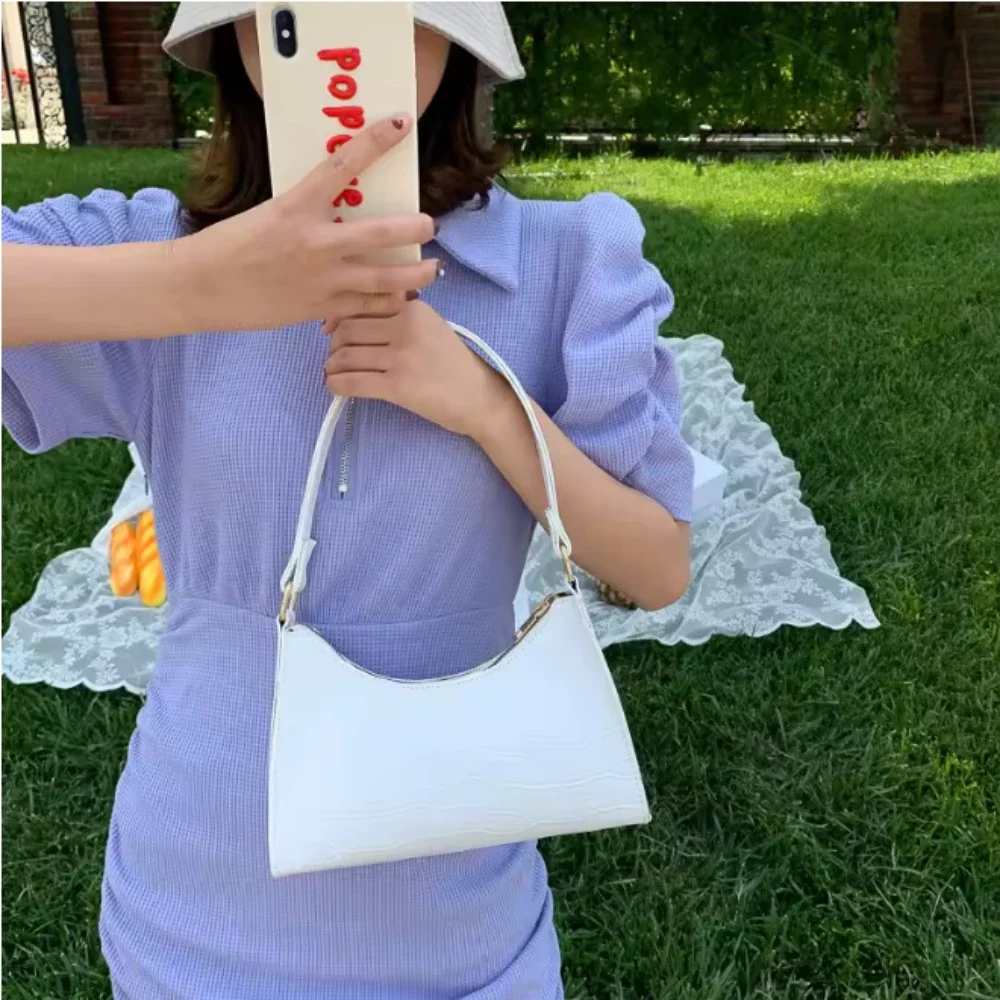 2025 bolsos exquisitos y elegantes para mujer, bolsos de hombro de viaje elegantes para mujer, bolso de cadena de Color sólido de cuero genuino para mujer