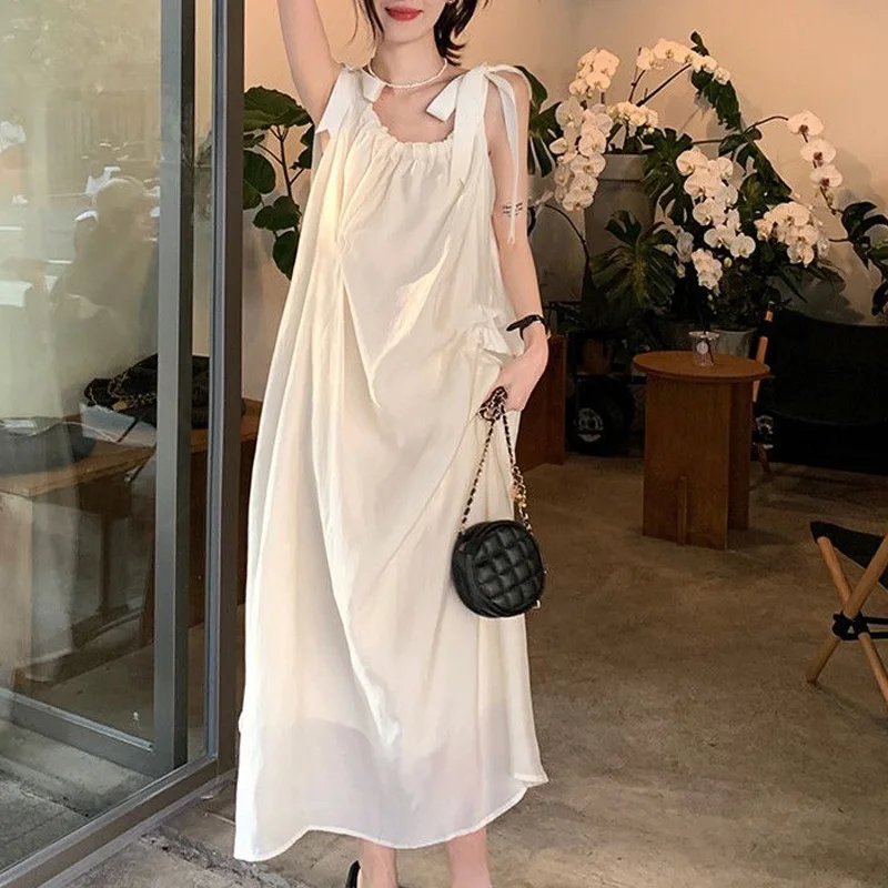 

2023 New Summer Gentle Temperament Beach Vacation Party Leisure Loose Beach Skirt Simple Fashion Strap Strap Women's Long Dress