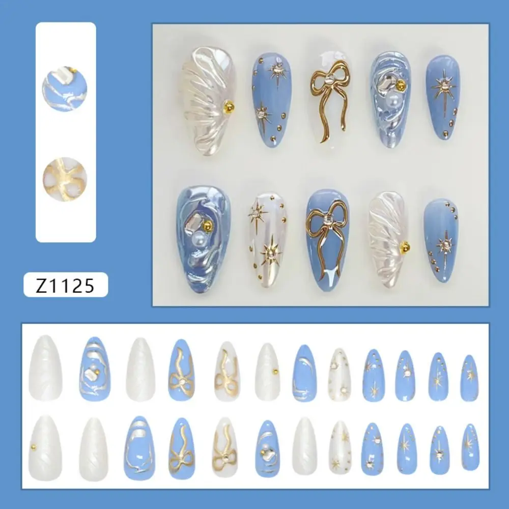 24 Stück lange mandelförmige künstliche Nägel, goldene funkelnde Schleife, Welle, französische Nägel zum Aufdrücken, Perle, Starburst, tiefblaue Katzenaugen-Streifen-Nagelspitzen