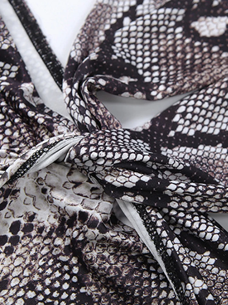 Kricesseen Sexy Deep Plunge Halter Snake Print Rompers For Women Sexy Backless Fitted Playsuits With Long Straps Night Out Wear