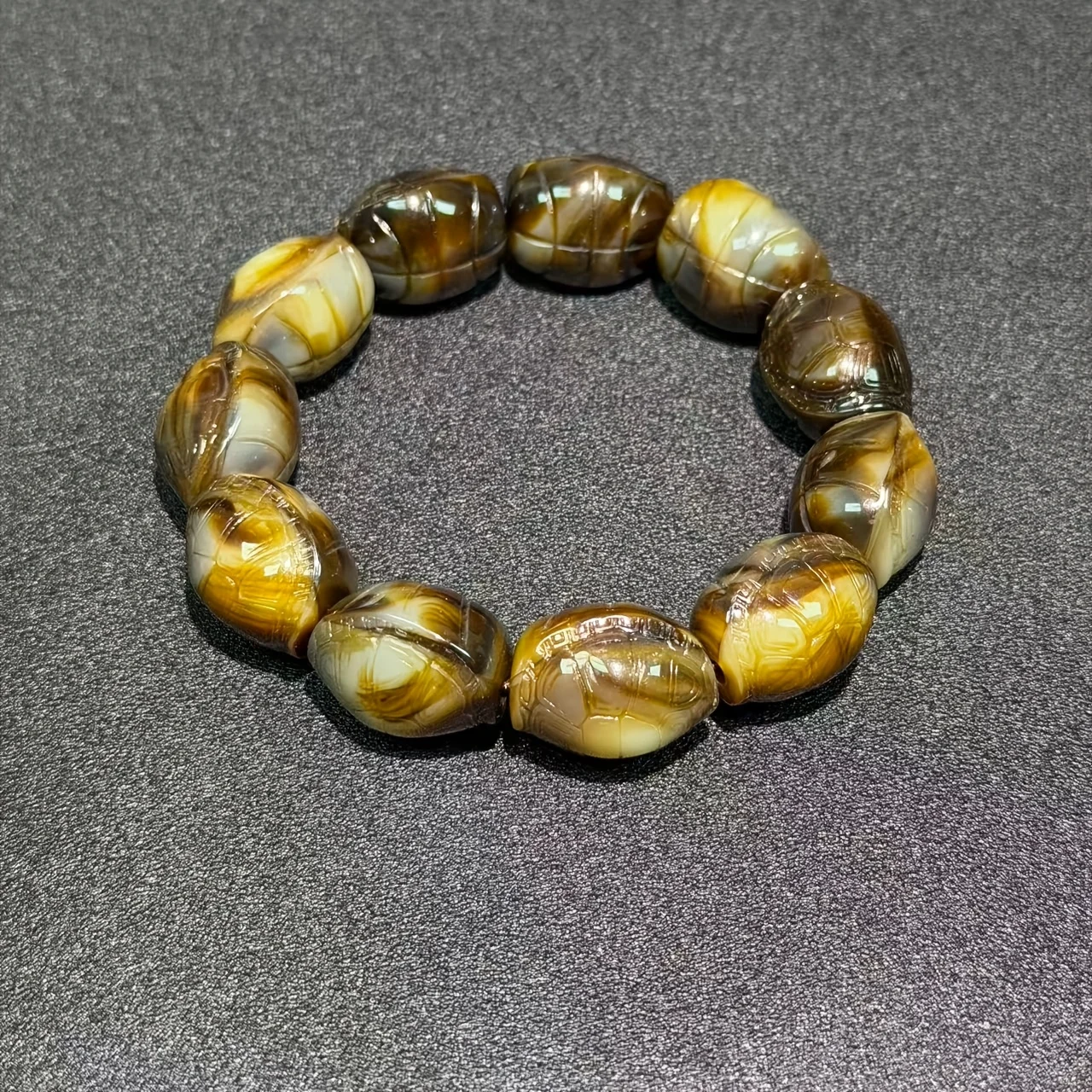 Amber and beeswax carved turtle bracelets, ancient beeswax jewelry