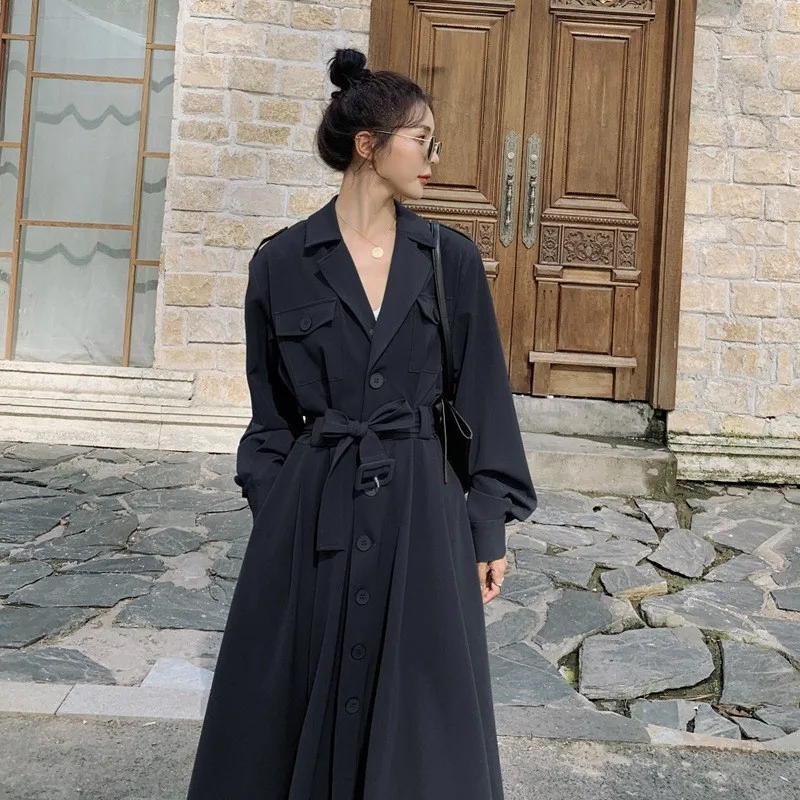 

A light mature coffee-colored elegant single-breasted cinched waist tie large swing suit collar windbreaker style dress