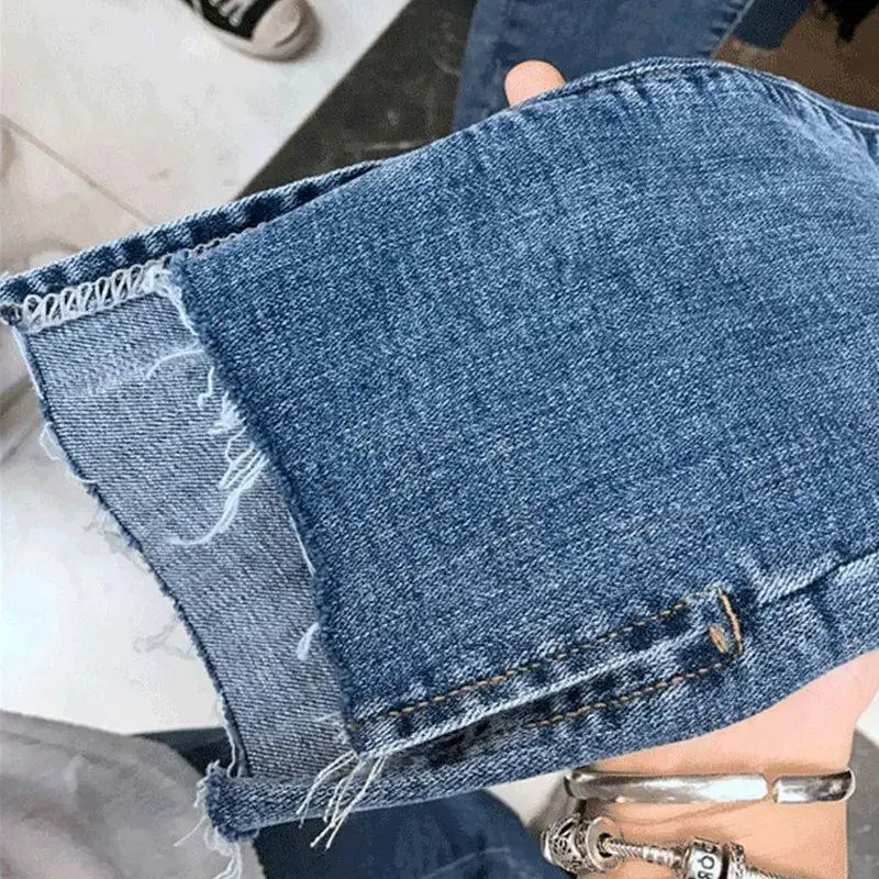 Hoge taille afslankende denim jeans Dames Faion potloodbroek Asymmetrische split Enkellange rechte pijpen Trendy gescheurd gat