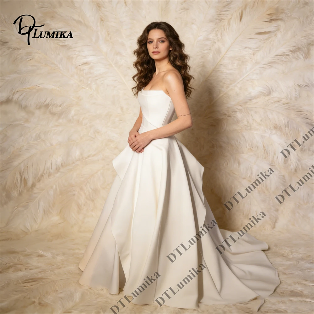 Strapless Satin Bridal Gown A-Line Silhouette with Ruffle Detail Sweep Train City Hall Wedding Dress Minimalist Chic Bride