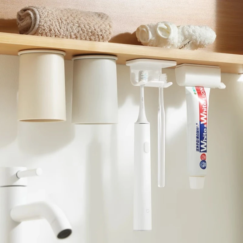 

Inverted magnetic mouthwash cup under mirror cabinet, toothbrush rack