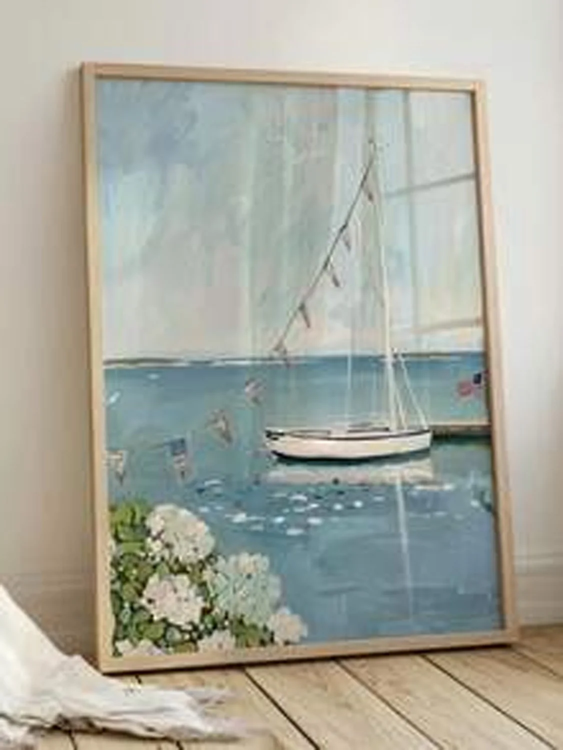 A canvas wall art piece This Coastal Voyage Painting depicts the scenery of a seaside villa in a maritime style