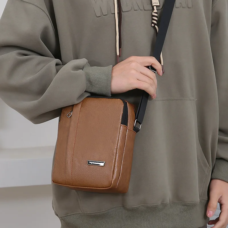 

PU leather men's casual single-shoulder bag for outdoor commuting, portable phone storage, large capacity crossbody bag