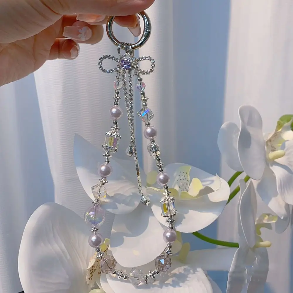 สายคล้องโทรศัพท์แบบพู่ประดับโบว์รูปหัวใจ ป้องกันการสูญหาย สายคล้องมือถือ จี้ห้อยกระเป๋า ประดับลูกปัด สำหรับสาวๆ ผู้หญิง