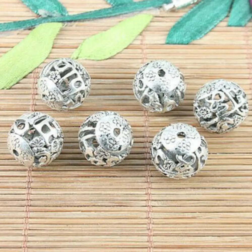 

10PCS 14mm hole 2mm TIBETAN SILVER TONE ROUND FLOWER PATTERNS HOLLOW SPACER BEADS H5102