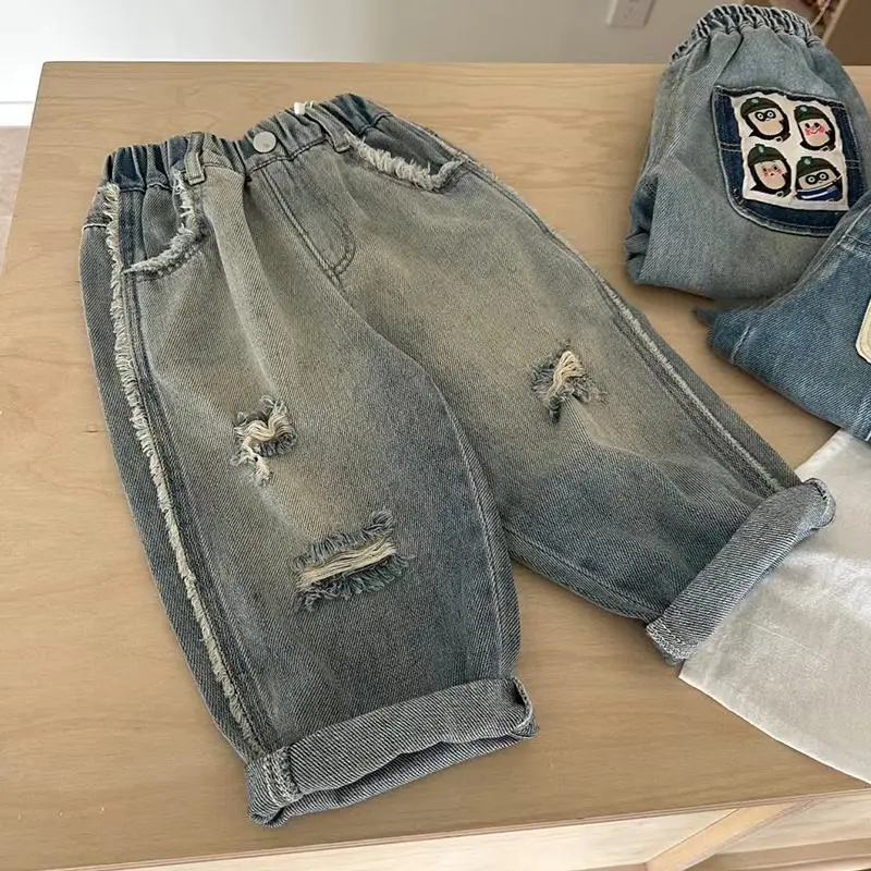 Boys' jeans Spring and Autumn new style western-style pants Children's Korean version ripped pants Baby casual loose pants