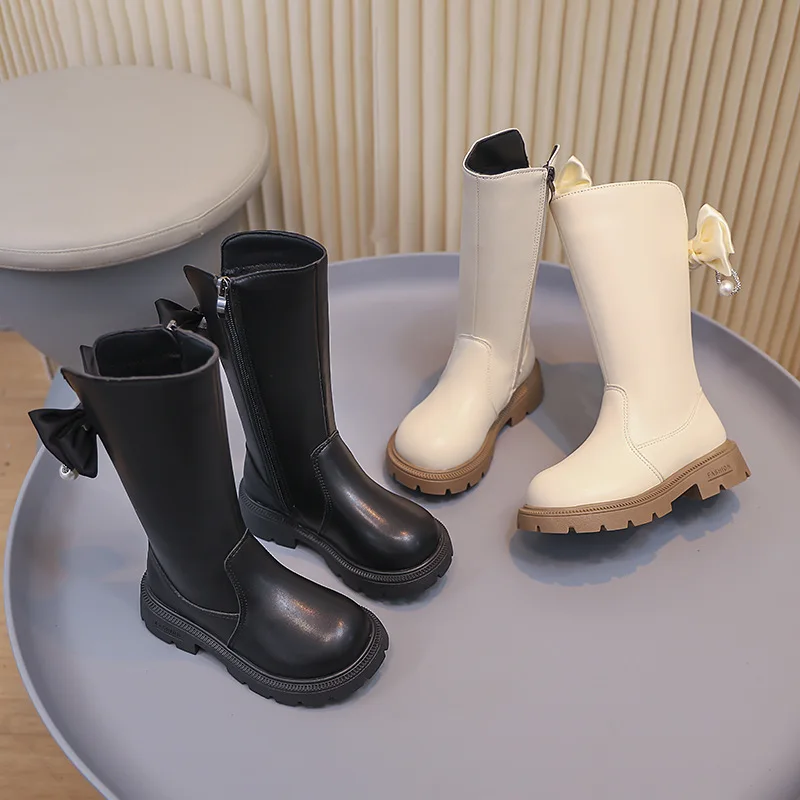 

Детская повседневная обувь ​ Высокие сапоги из искусственной кожи с бантом, зимняя обувь на низком каблуке для девочек, нескользящая теплая черная белая обувь, размер 26-37