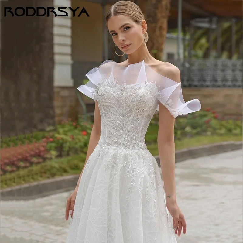 فستان زفاف كلاسيكي بأكمام قصيرة مكشكش من RODDRSYA مطرز بالترتر على شكل حرف a من الدانتيل Vestidos De Novia ذيل محكمة بسحّاب خلفي 2024 مطرز بالترتر على شكل حرف a من الدانتيل Vestidos De Novia ذيل محكمة بسحّاب خلفي 2024