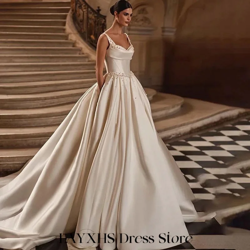 LAYXHS فساتين زفاف كريمة السباغيتي الأشرطة اللؤلؤ ألف خط الطية الطابق زي العرائس مخصص رداء دي ماري