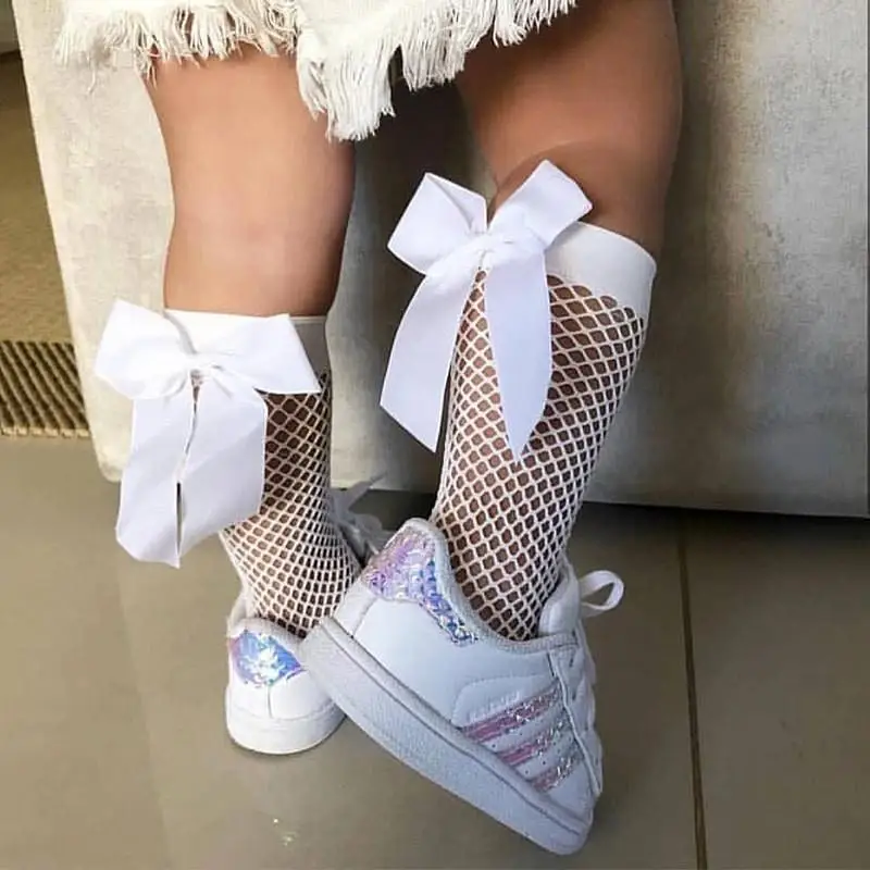 Calcetines de rejilla para niñas con lazo, estilo princesa dulce, calcetines de malla hueca con encaje para niñas, medias cortas hasta el tobillo en blanco y negro, de 3 a 12 años