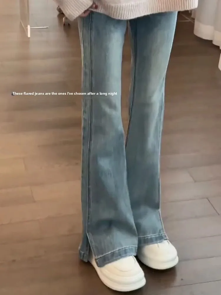 

Голубые эластичные расклешенные джинсы с высокой талией. Женские повседневные джинсовые брюки с выцветшим эффектом. Брюки длиной до пола.