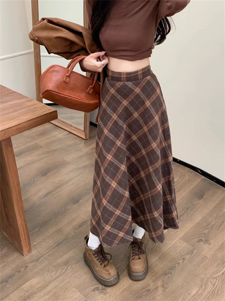 تويد منقوشة عالية الخصر نصف الجسم تنورة الإناث الخريف والشتاء جديد ريترو فضفاض ساحات كبيرة الترفيه طويلة ألف خط نصف الجسم تنورة