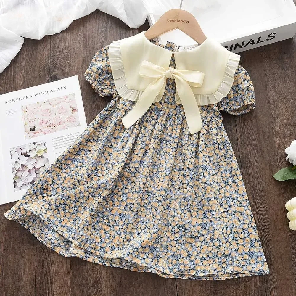 Leisure Countryside Style Girls' Clothes Lapel Bow Bubble Sleeve Princess Dress Floral Summer New Style for Children Aged 2-7