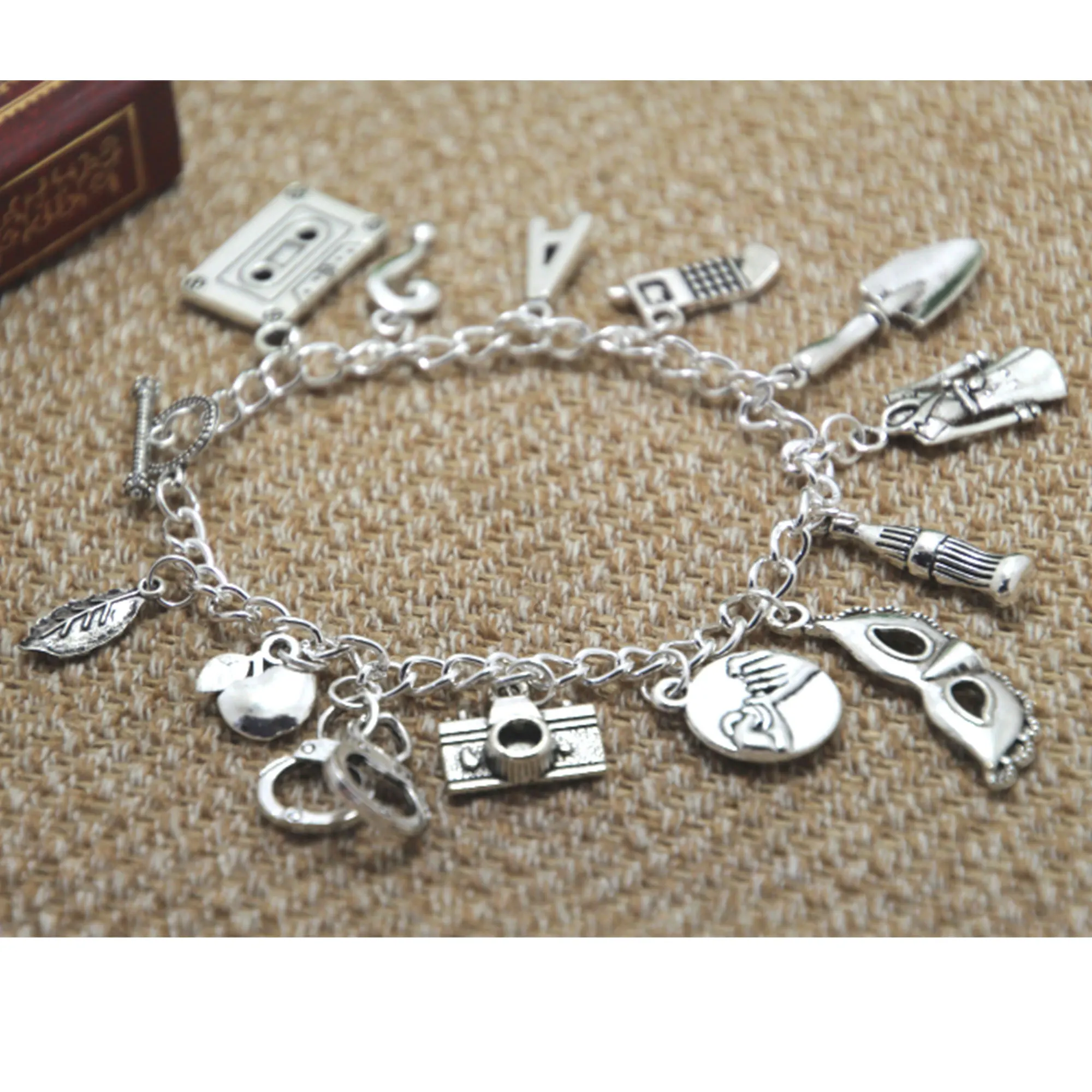 

12pcs Pretty Little Liars Inspired Charm Bracelet Silver Tone