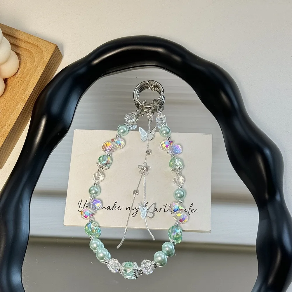 

Блестящая цепочка для телефона с жемчугом и кристаллами, короткий ремешок-бабочка с кисточкой, защита от потери, украшение для чехла, ремешок на запястье