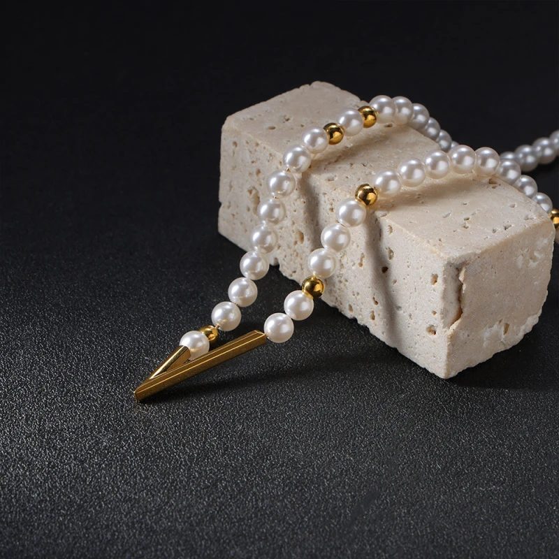 CarlidanaPearl Geometry V Arrow Beaded Necklace Fine bead stitching gold spacer beads for a high-end jewelry look