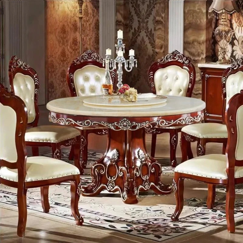 

Ресторан X-S Hotel Villa с круглым столом-вертушкой из массива дерева с резьбой и мраморной отделкой.