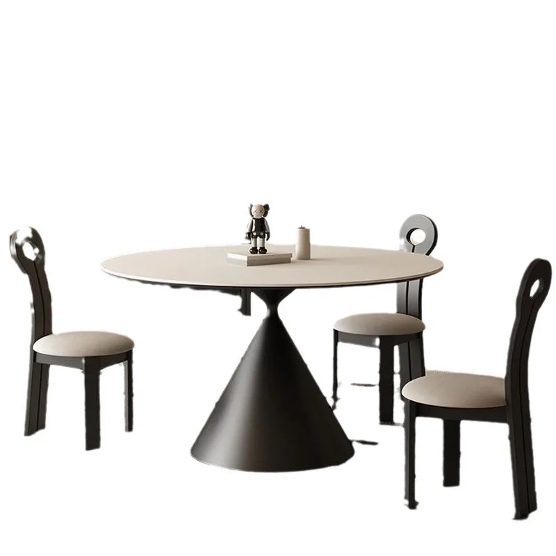 

Small apartment Italian minimalist design with round slate dining table and chairs