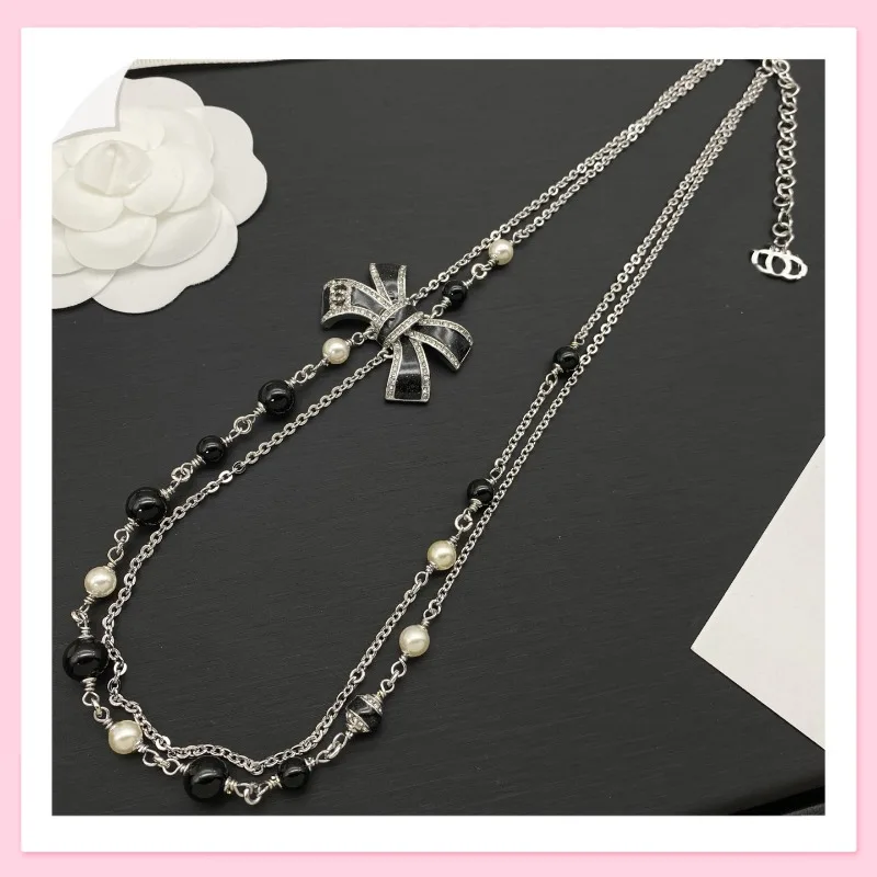 

Женское ожерелье с маленьким бантом и двойной буквой, легкое, роскошное, модное, универсальное, с изысканным нишевым дизайном