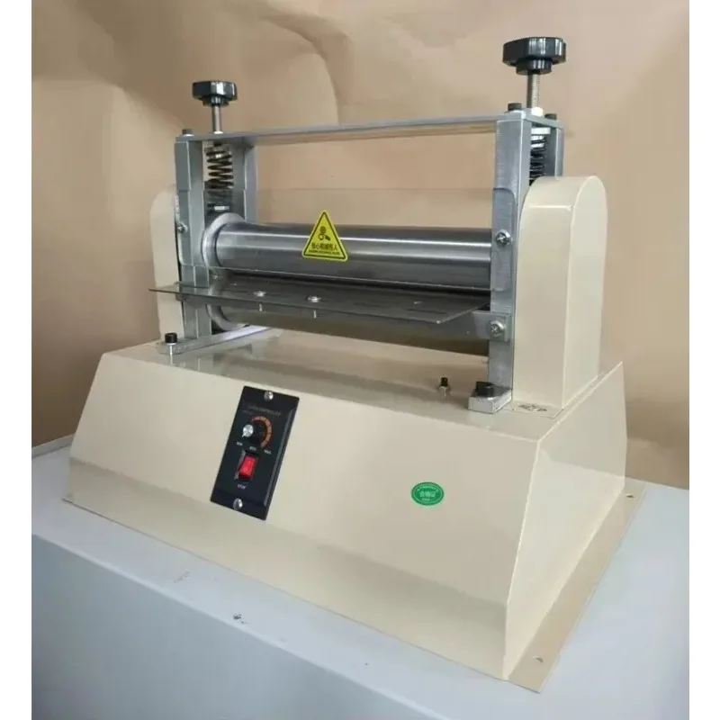 Leather shoulder strip adhesive roller folding machine