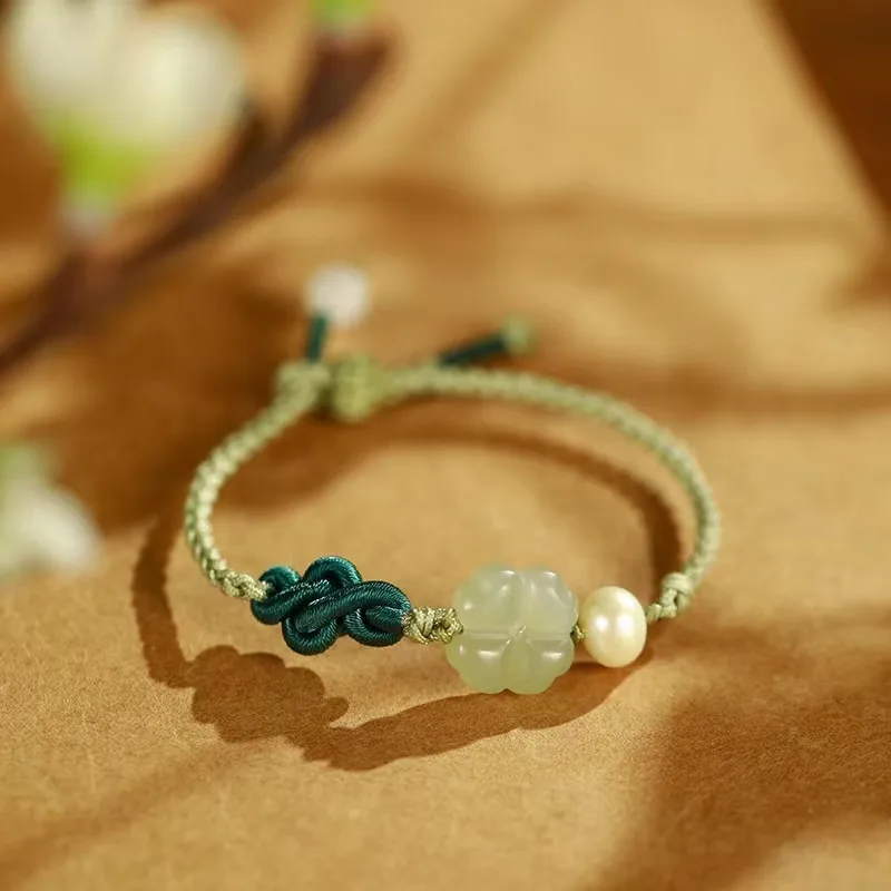 

Hotan Jade Four leaf Grass Bracelet Female Xia Senior Sense Army Green Hand Rope Braided Rope Pearl Hand String Batch