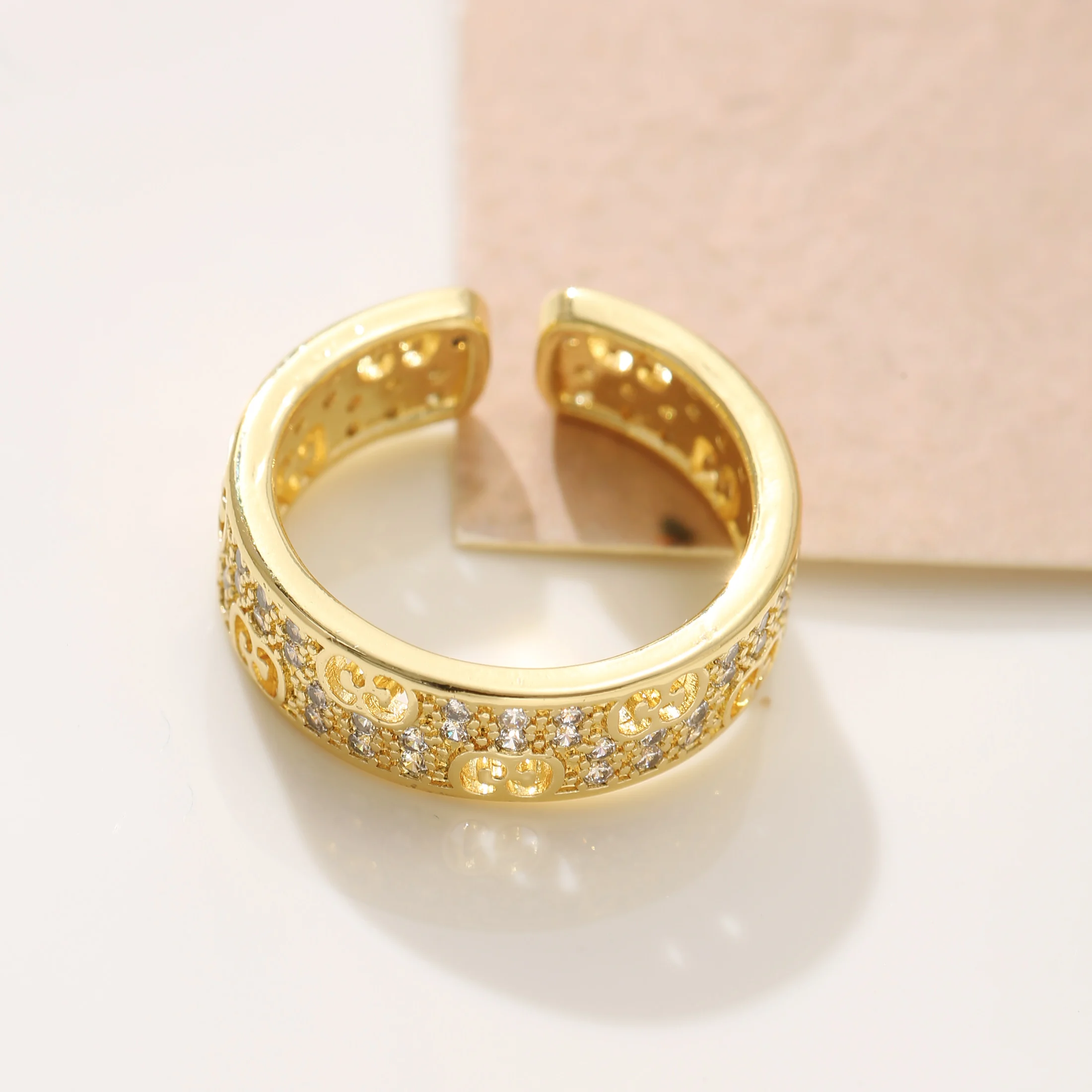 

Golden Tone Stainless Steel Open Ring with Interlocking Pattern and Synthetic Zirconia for Women