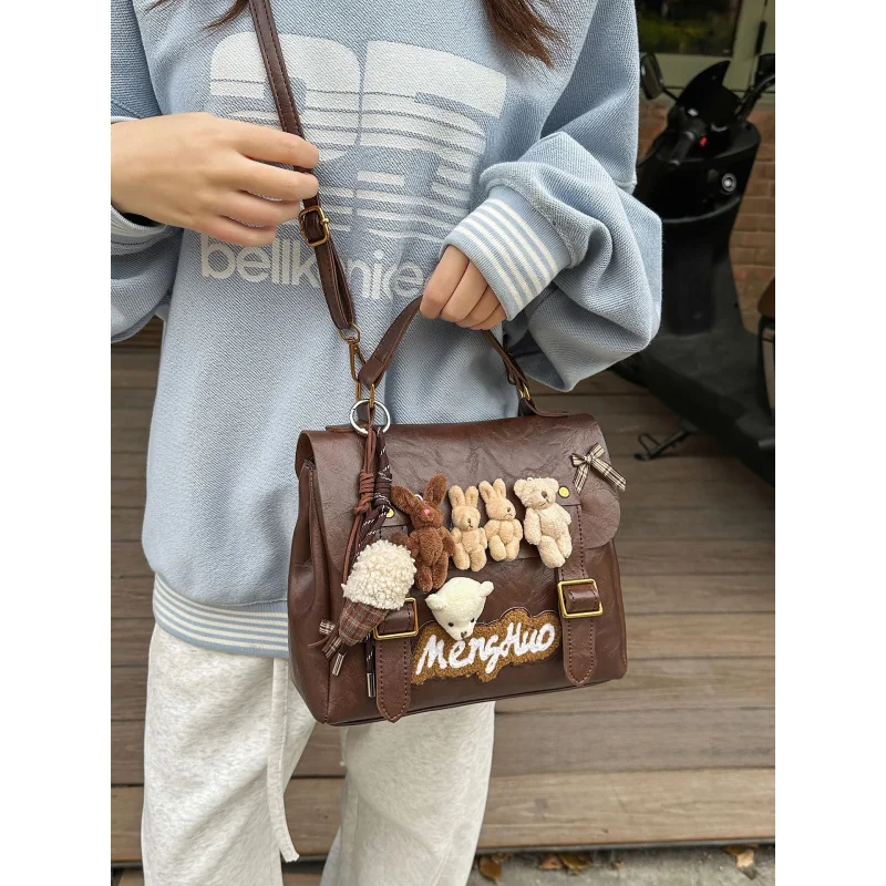 

American-style niche cute plush toy backpack for women2025New College-Style Handbag and Crossbody Bag, Multifunctional Backpack