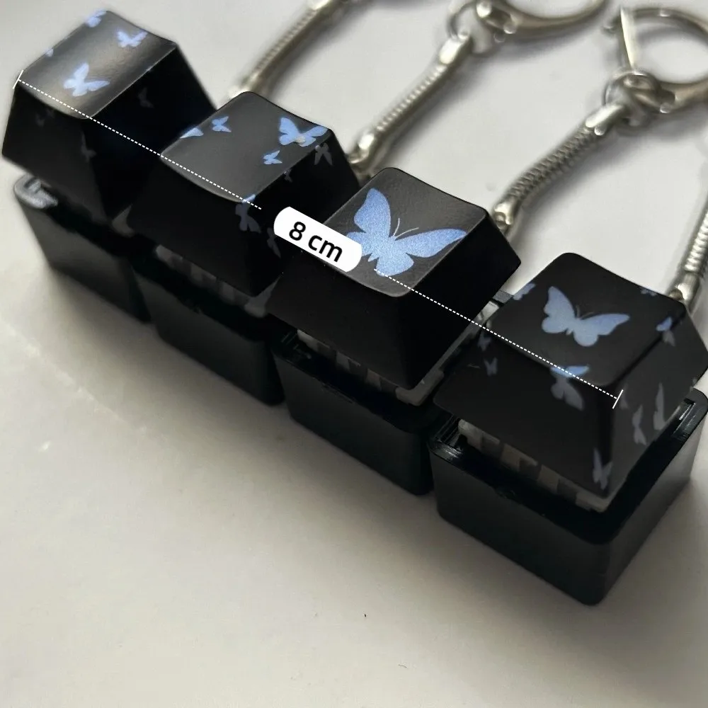 Decompressione 4 tasti Pulsante Keycap Portachiavi Tappi tastiera Pulsante brillante Keycap Passa il tempo Sollievo dallo stress Clicker Giocattolo Regalo