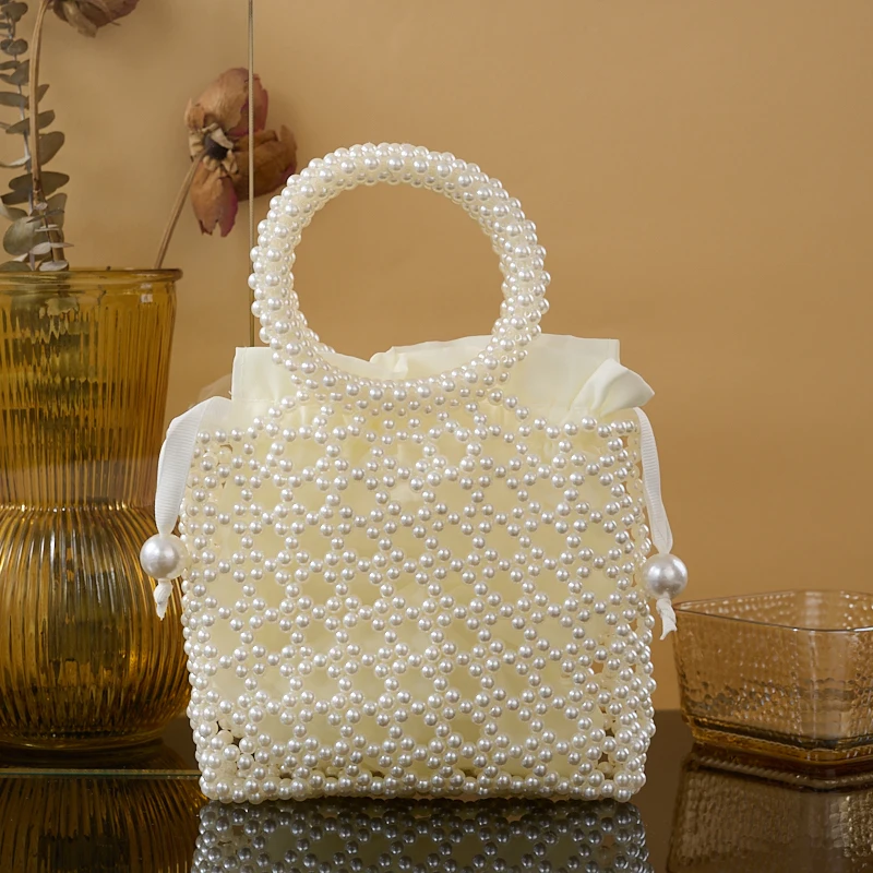 New pearl women\'s bag hand-beaded finished fashion catwalk women\'s cross-body bag light luxury texture net red mobile phone bag