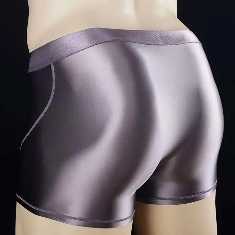 Calzoncillos elásticos para hombre, ropa interior Sexy de satén brillante con costuras, pantalones cortos deportivos ajustados