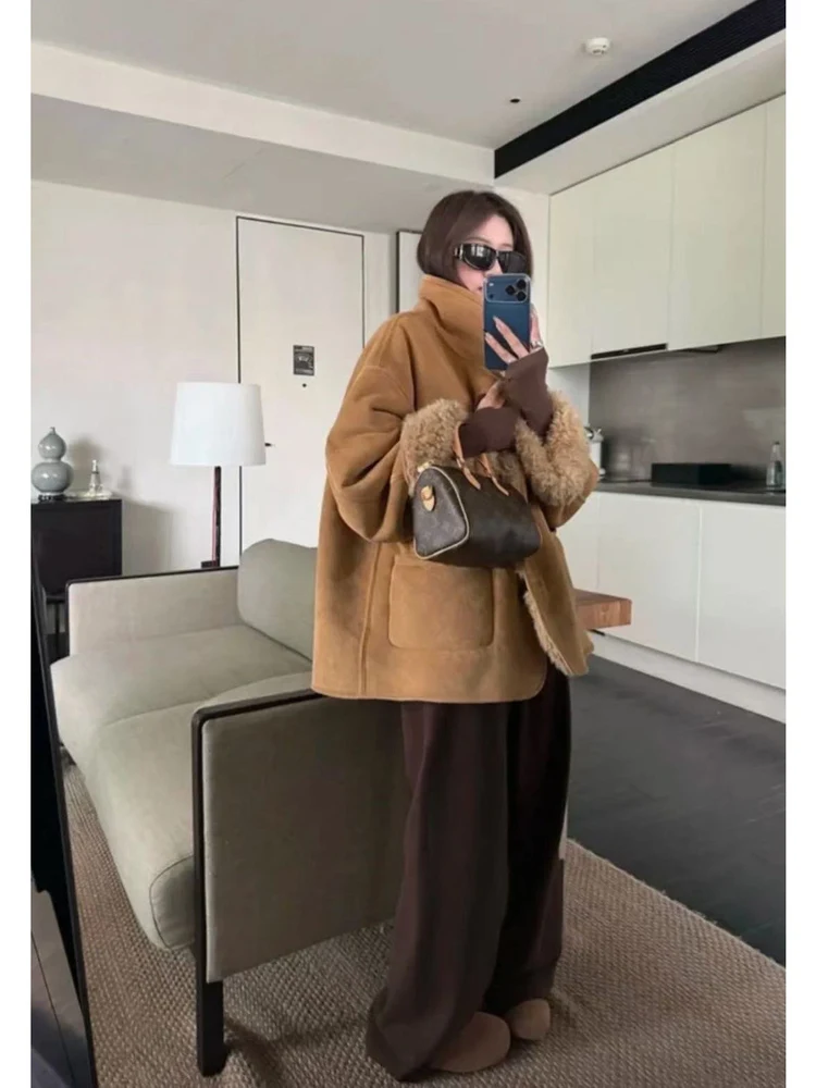 الرجعية Sle المرأة طويلة Sve Jaet فضفاضة تناسب زر واحد إغلاق الدافئة الجلد المدبوغ معطف فرو الضأن Dongda بوابة خمر الرياح