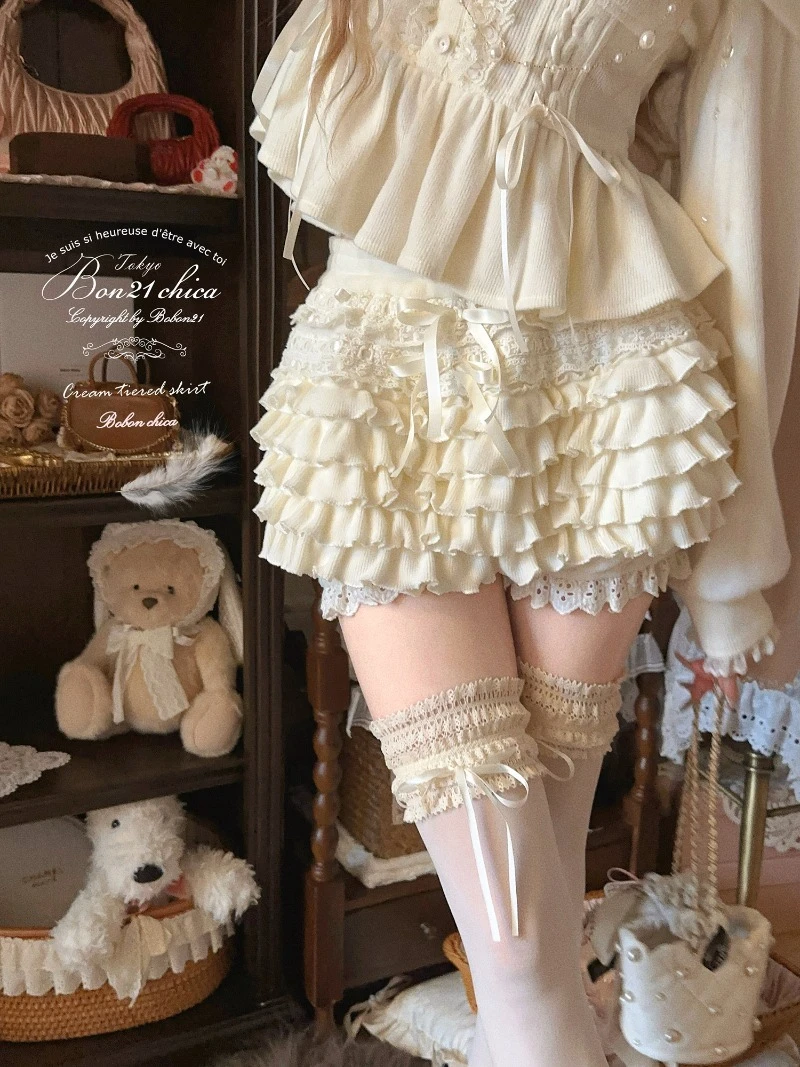 النمط الفرنسي Kawaii الملابس الوردي السراويل القصيرة كريم سحابة الخريف والشتاء جديد الحلو كولوتيس محبوك الطبقات كعكة تنورة السراويل